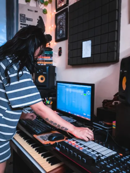 In the studio, working on a new idea. You can see my hands on the M-Audio keyboard and my Ableton project on the screen. This is the starting point for so many tracks, and I teach how to go from a simple melody to a full song.