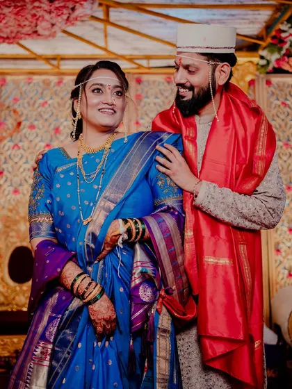 The couple looks at each other with love and admiration.
