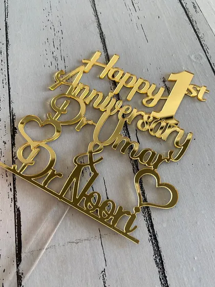 A flat lay of the "Happy 1st Anniversary" topper, allowing a clear view of all the design elements.