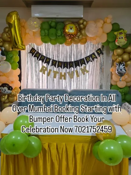 A simple jungle-themed decoration perfect for a home setup. The balloon arch with animal print and character foils is set against a silver shimmer curtain, creating a fun photo corner over the sofa.