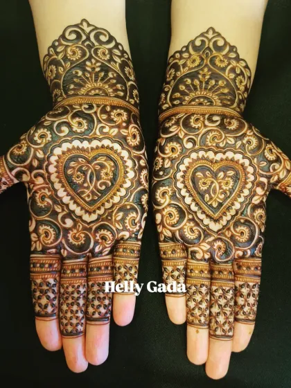 A perfect design for a bridesmaid or sister of the bride. This symmetrical pattern features a beautiful heart motif, filled with intricate details and delicate swirls. It’s a full-hand design that is both elegant and celebratory.