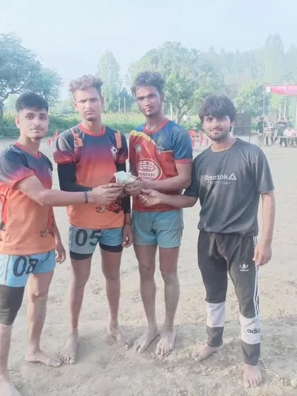 My players with their prize money after securing first place.