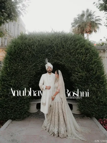 Anubhav and Roshni's wedding in Istanbul was a fairytale. This portrait, set against the perfectly manicured gardens and historic architecture of the Ciragan Palace, captures the timeless elegance of their celebration.