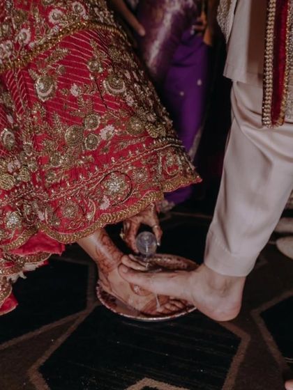 A beautiful moment from a wedding ritual, where the bride's mehendi-adorned feet are part of the ceremony. It's a reminder of how mehendi is woven into our traditions.