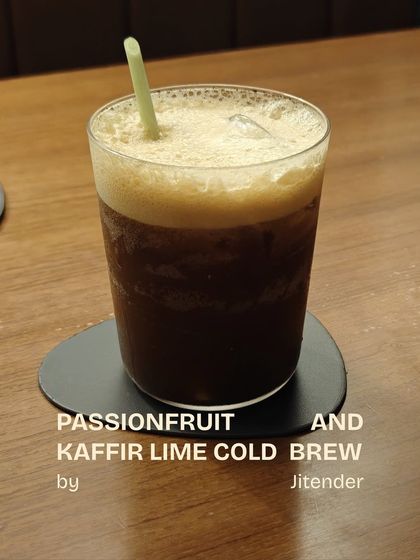 An experimental creation by Jitender, the Passionfruit and Kaffir Lime Cold Brew. This unique non-alcoholic drink combines the acidity of passionfruit with the aromatic notes of kaffir lime and coffee.