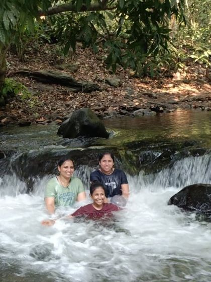 Taking a refreshing break in a natural stream. This is one of the simple joys of trekking in the forests of Ulavi.