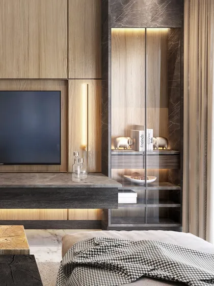 A detail of the TV unit and display cabinet in the South City residence. The combination of wood, stone, and glass creates a sophisticated and layered look.