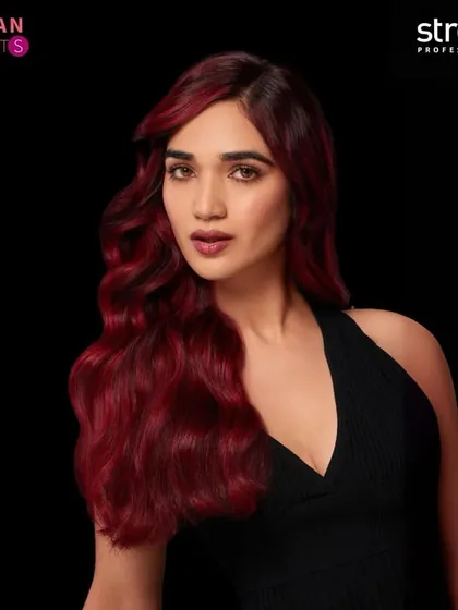 For this Streax Professional campaign shot, I created a bold makeup look with a defined, dark lip and contoured eyes to match the intensity of the vibrant red hair color.