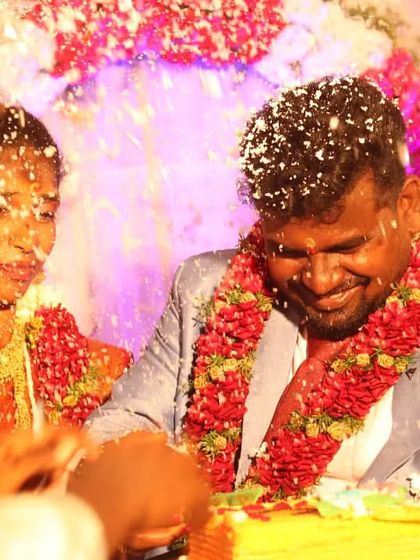 The cake cutting ceremony, a moment of sweet celebration. The couple is showered with confetti, and their joyful expressions show the fun and festive atmosphere of the reception.