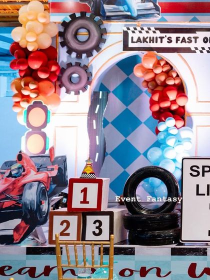 A close-up of the "Lakhit's Fast One" setup, showing the speed limit sign, stacked number blocks, and a red race car prop.