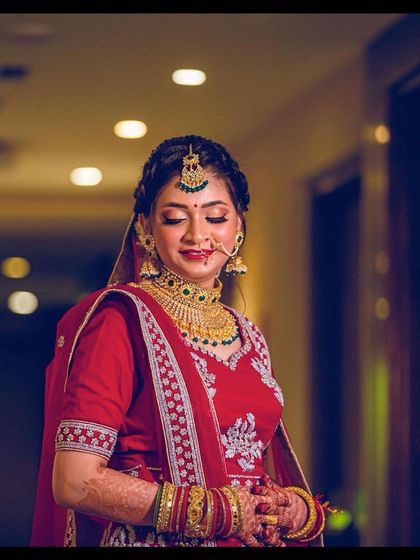 A beautiful candid moment of the bride, with her makeup looking flawless.