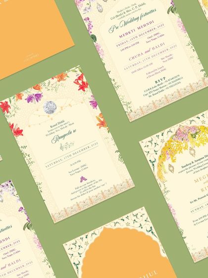 A flatlay of the minimal floral suite, showing how the different cards for the Mehendi, Sangeet, and wedding ceremony come together. The consistent floral theme creates a cohesive and beautiful set.