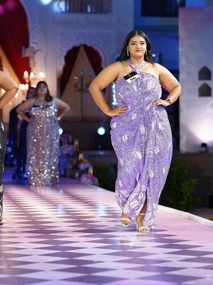Another look at the lavender sequined plus-size gown, showing how it sparkles on the runway.
