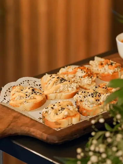 My take on bruschetta, featuring a creamy chicken topping on toasted bread, garnished with black sesame seeds. It's a simple, elegant, and flavorful appetizer.