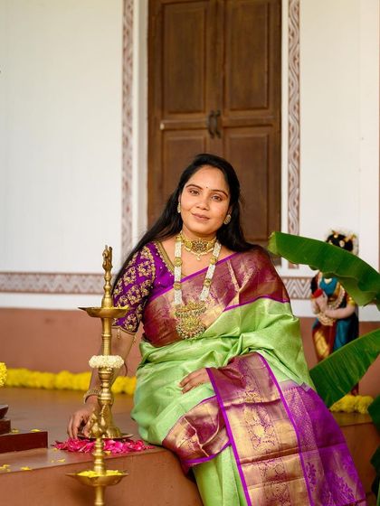 A solo portrait from the Diwali collaboration. Her makeup is elegant and understated, allowing the rich colors of her saree and the intricate gold jewellery to take center stage.