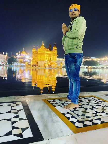 Paying my respects at the serene and beautiful Golden Temple in Amritsar. The tranquility of the Sarovar at night is truly unforgettable.