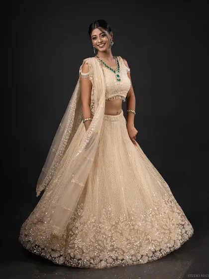A full-length portrait showcasing an elegant, embroidered lehenga. My ethnic wear photoshoots focus on the beautiful details of the garment and the model's poise.
