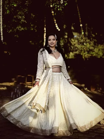 An engagement look in a beautiful ivory chikankari lehenga. I created a soft cut-crease eye makeup look to add a touch of glamour while keeping the overall feel romantic and elegant for her evening function.