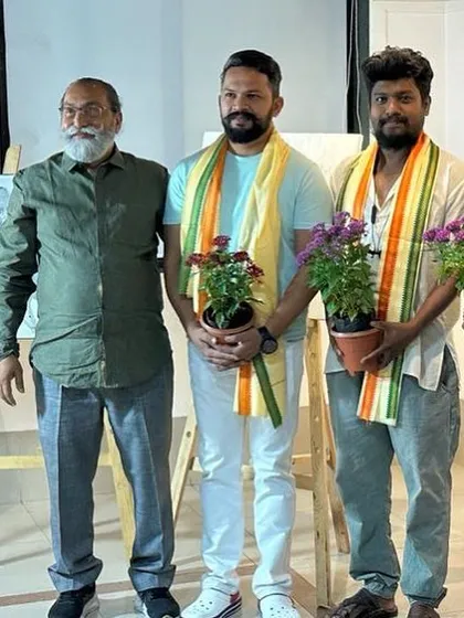 Being felicitated alongside fellow artists at the event.