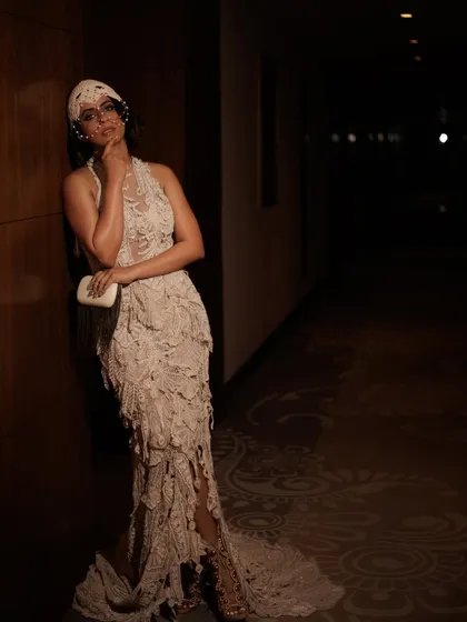 This image captures the full elegance of the textured gown and headpiece for the Vogue India editorial. The makeup and hair provide a polished foundation for a very creative and unconventional fashion look.