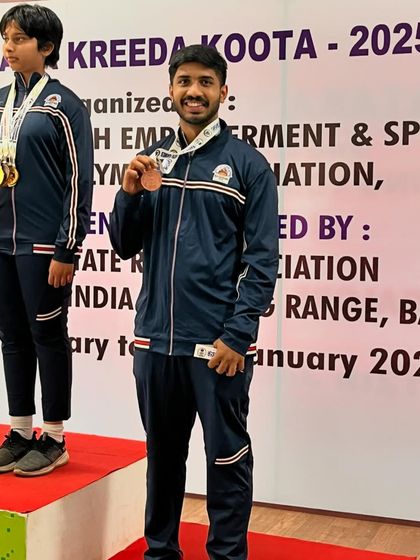 One of our shooters on the podium after winning a medal in a 25m pistol event at the Nagaraj Rao competition.