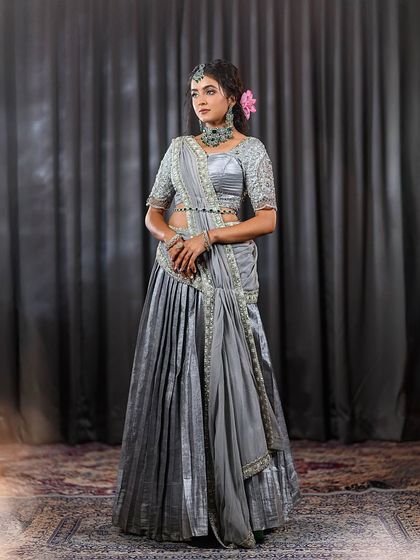A full-length shot of the elegant grey lehenga-saree, perfect for a sophisticated evening event.