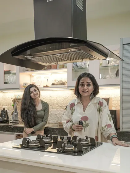 A photo of me with a client in her new kitchen.