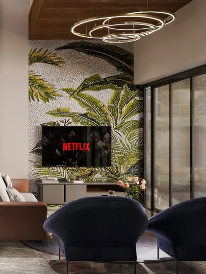 The TV wall features a captivating tropical mosaic wallpaper, bringing a vibrant and artistic element to the living space. It serves as a stunning backdrop that adds personality and a 'wow' factor.