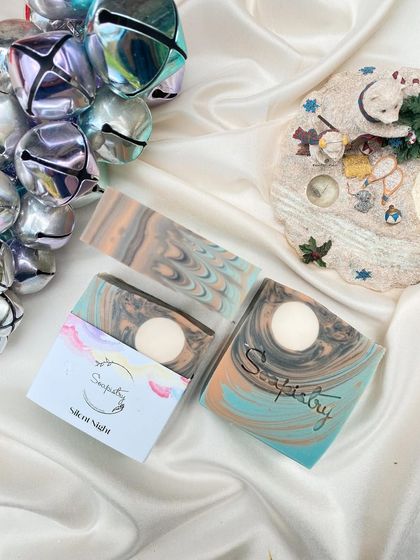 The Silent Night soap, with its calming colors and a moon embed, captures the peace of a winter's night.