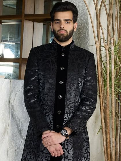 The black patterned kurta with a velvet placket and silver buttons is a tale of refined luxury. It is designed to make you feel poised and elegant.