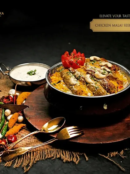 Elevate your taste buds with our Chicken Malai Seekh Biryani, a royal indulgence where succulent kebabs meet aromatic rice.
