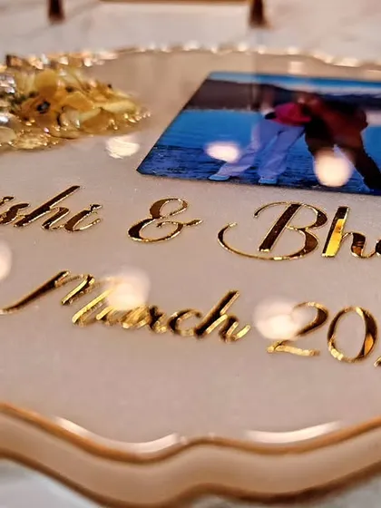 A simple and elegant photo frame made with love, personalized with the couple's names and wedding date.