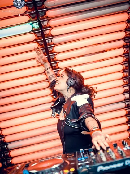 Pointing to the sky as the beat drops at Lion Bar. It's all about sharing that peak energy with everyone in the room.