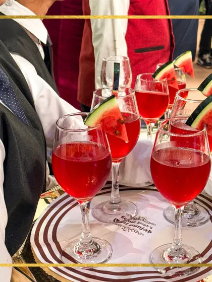 A tray of our watermelon coolers, a perfect welcome drink for a summer event. The presentation is simple, elegant, and refreshing.