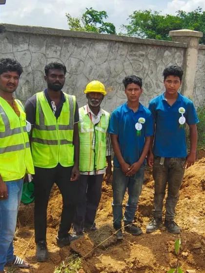 The team poses for a picture during a break from a planting project, showcasing the positive and collaborative spirit of our workforce.