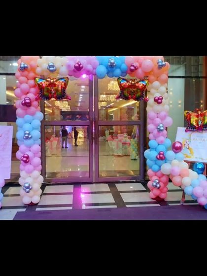 A closer view of the butterfly-themed entrance arch, perfect for making a great first impression.