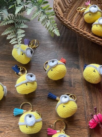 An army of handmade minion keychains ready to go. We take bulk orders for these, and they make fantastic party favors or return gifts.
