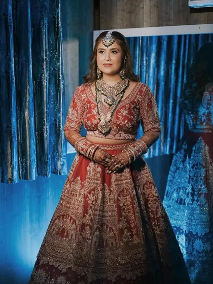 My bride Pooja, looking powerful and regal before walking down the aisle. The makeup features a slightly bolder eye to match her magnificent jewelry.
