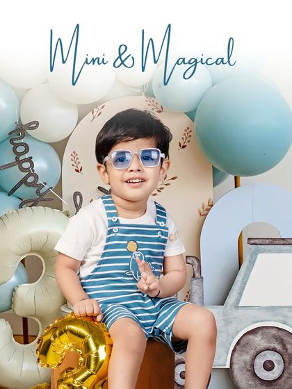 Mini and magical. This little man is celebrating his third birthday in style with a cool blue theme and a smile that lights up the entire studio.