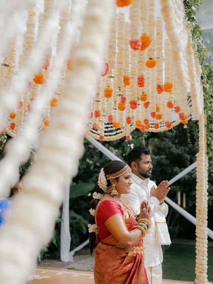 I have had the honor of hosting many beautiful South Indian weddings. The lush greenery and traditional decor elements, like floral arrangements and brass lamps, create an authentic and sacred atmosphere for the ceremony.