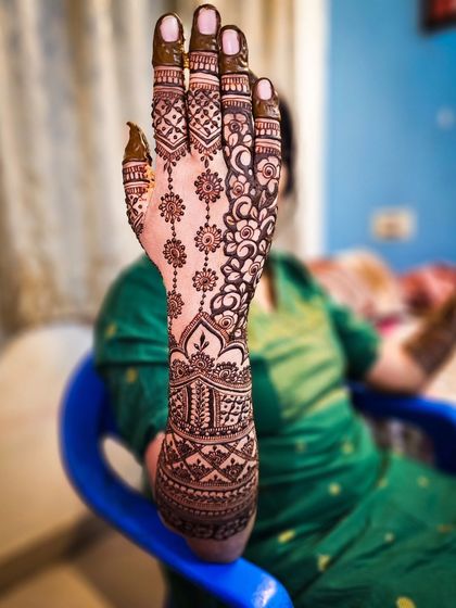 A single arm shot showing the beautiful floral vine pattern.