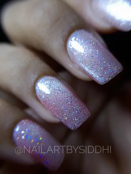 A close-up macro shot of this stunning cat-eye and holographic glitter combination, showing the depth and sparkle.