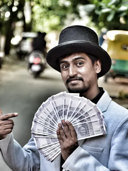 Who doesn't love a bit of money magic? It's a fun and cheeky part of my act that always gets the crowd excited. This is the kind of engaging entertainment I bring to corporate events and private parties.
