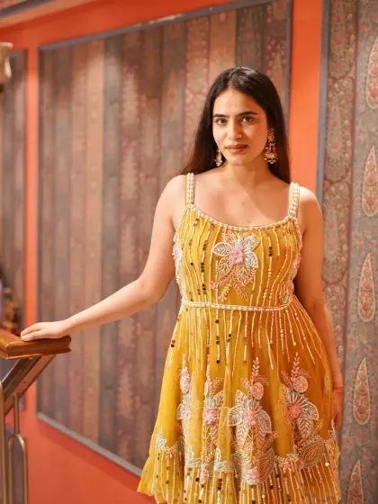 Another look at this charming yellow short dress, perfect for a fun and festive daytime event.