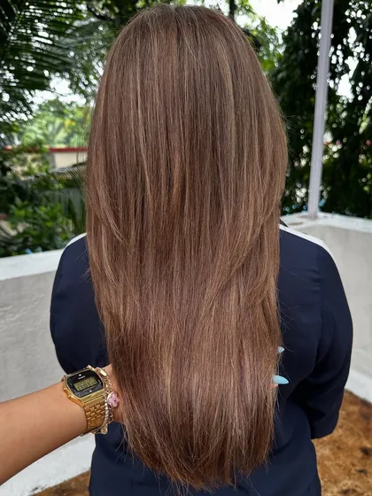 A classic 'Ash Blonde'. This is a great option for those who want to go lighter but prefer cooler tones over warm, golden shades. It's sophisticated and chic.