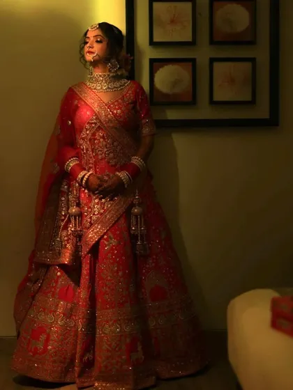 A full-length portrait of this beautiful bride. The dramatic lighting adds a touch of royalty to her look.