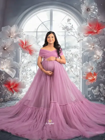 A solo portrait in our winter wonderland setup. The flowing purple gown and giant paper flowers create a magical, fantasy-inspired scene.