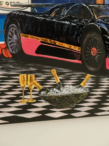 A detail from "Pagani, Prada & pandemonium," focusing on the untouched champagne and checkerboard floor, elements of a staged ecosystem of taste.