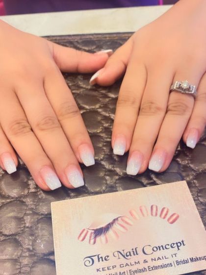 A classic baby boomer ombre with a glittery finish on short, square nails. This is a perfect choice for a chic and low-maintenance look.