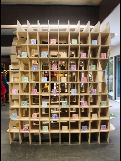 The front view of 'Stradata' reveals its intricate, grid-like construction. The entire installation was optimized for minimal material wastage and designed to be self-supporting without glue or chemicals, reflecting our interest in sustainable building practices.